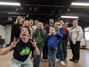 group of people making silly funny faces at a drama workshop